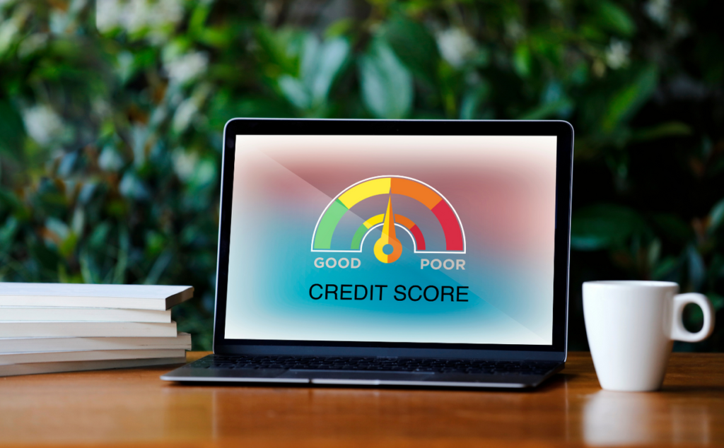 Laptop computer showing a credit score between good and poor